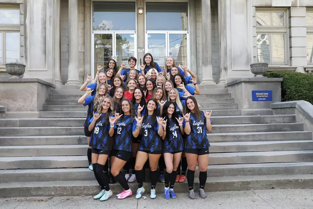Women's Soccer Team in fron of Columbia Gym